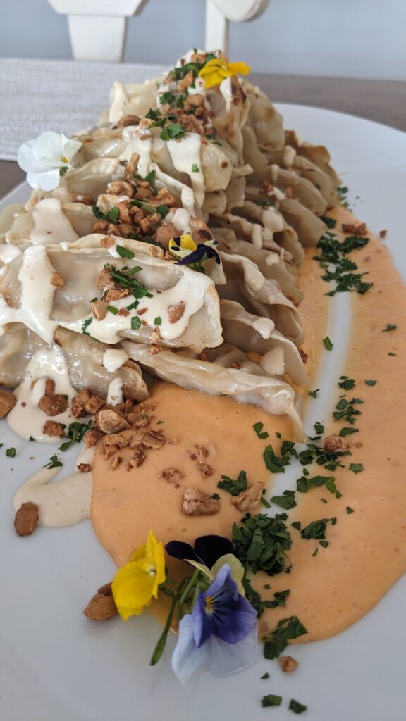 Kung Pao Chicken Dumplings Topped with Butter toasted Cashews, Soy Aioli and our Signature BANG Sauce. Served in New Jersey